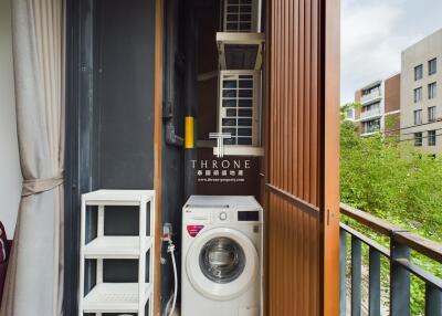 Compact laundry area with washing machine on balcony