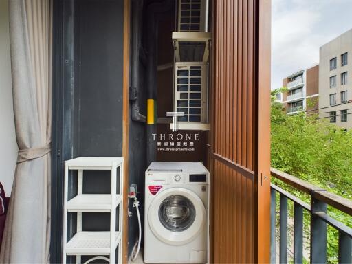 Compact laundry area with washing machine on balcony