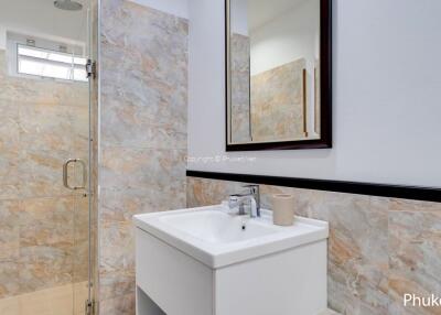 Modern bathroom with sink and walk-in shower