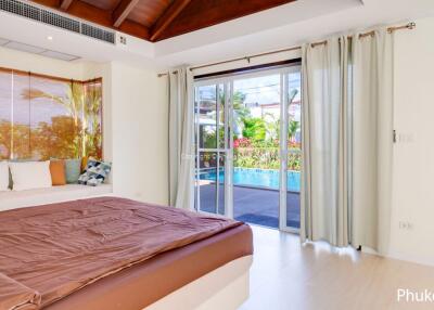 Cozy bedroom with a pool view