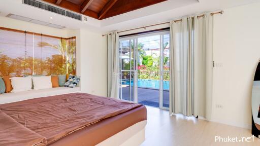 Cozy bedroom with a pool view