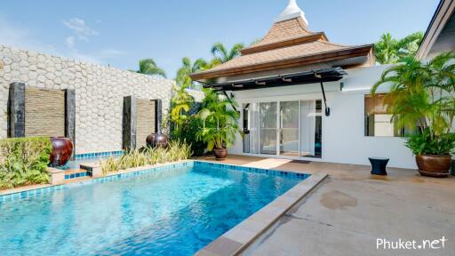 Outdoor area with swimming pool and traditional building