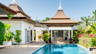 Luxury villa exterior with swimming pool and tropical plants