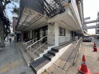 Front entrance of the building with accessible ramps and stairs