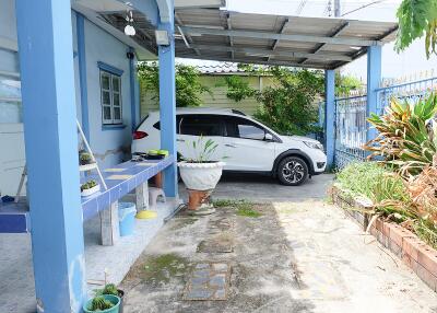 Covered carport with garden area