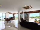 Spacious living room with large windows and balcony view