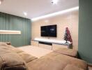 Modern living room with TV, sofa, and decorative items