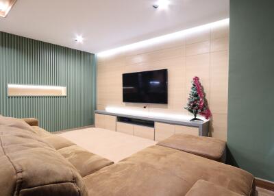 Modern living room with a mounted TV and decorative elements