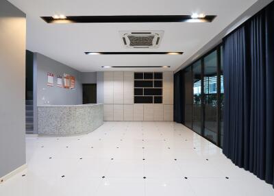Modern lobby area in commercial building with reception desk