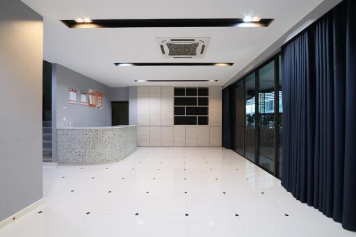 Modern lobby area in commercial building with reception desk