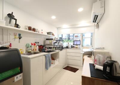 Modern kitchen with various appliances and a clean, sleek design