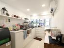 Modern kitchen with various appliances and a clean, sleek design