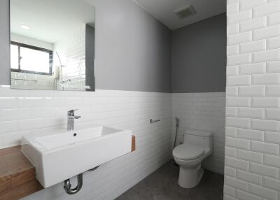 Modern bathroom with white sink and toilet