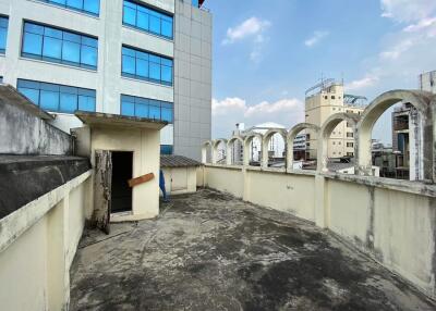 Rooftop area of a building with city views