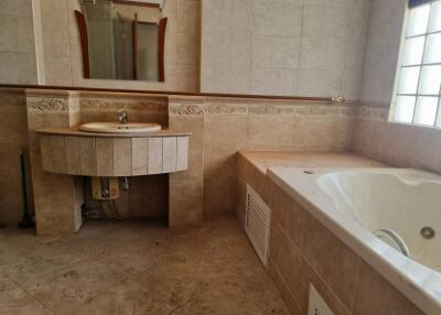 Bathroom with sink, mirror, and bathtub