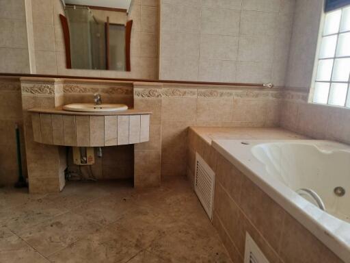 Bathroom with sink, mirror, and bathtub