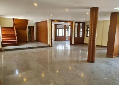 Spacious main living area with polished floors and wooden features