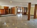 Spacious main living area with polished floors and wooden features