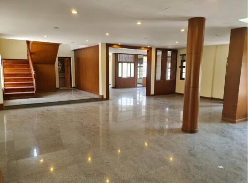 Spacious main living area with polished floors and wooden features