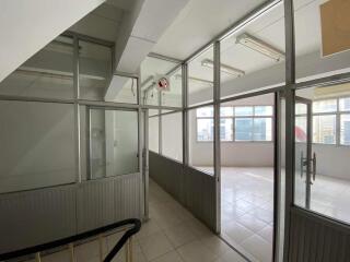 Office space corridor with glass partitions