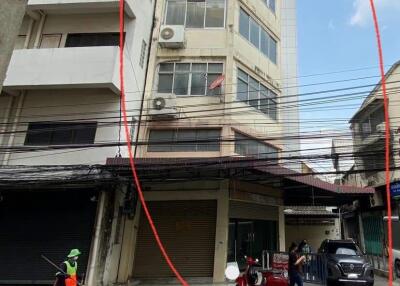 Exterior view of a multi-story building with street in front