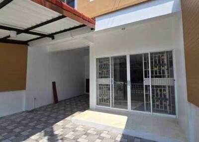 Front entrance with tiled patio and sliding doors