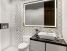 Modern bathroom with vessel sink and illuminated mirror