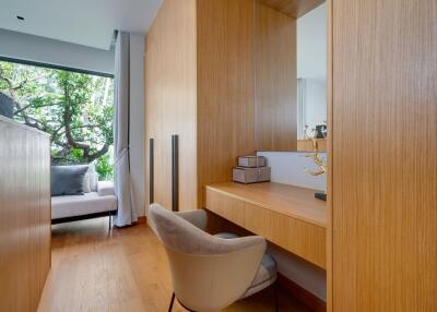 Modern bedroom with wooden elements and a large window