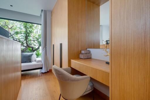 Modern bedroom with wooden elements and a large window