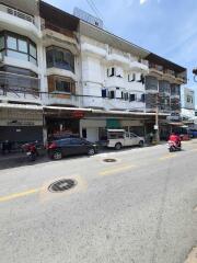 Street view of multi-level commercial and residential building