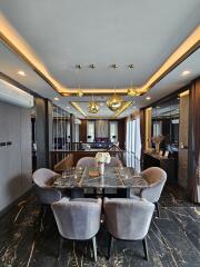 Modern dining room with marble table and hanging lights