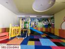 Children's playroom with colorful play equipment and floor mats