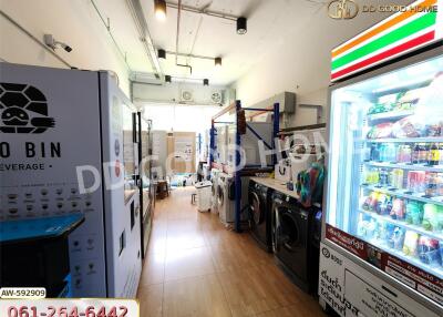 Utility room with washing machines and vending machines