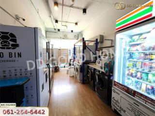 Utility room with washing machines and vending machines