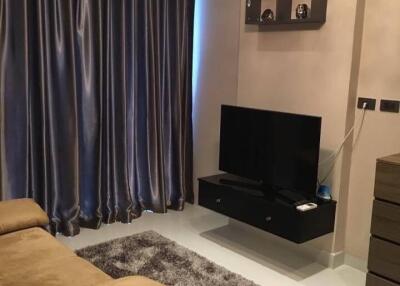 Modern living room with curtain, TV, and chandelier