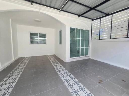 Interior space with tiled floor and large window