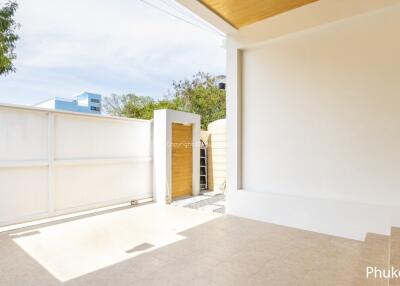 Modern outdoor area with gate and tiled floor