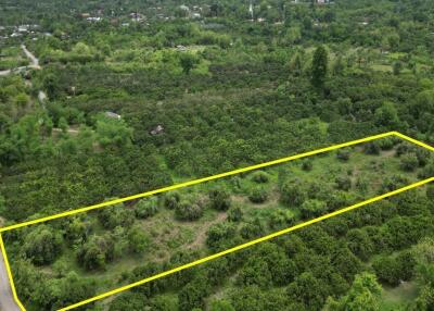 Aerial view of a large plot of land bordered by yellow lines