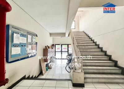 Lobby with staircase and information boards