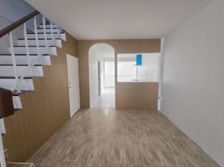 Empty living room with staircase and open space