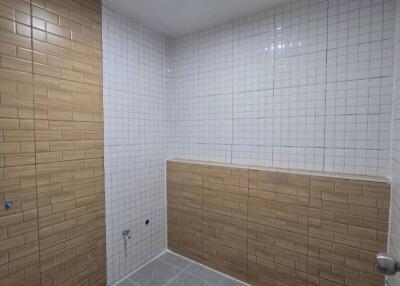 Modern bathroom with tiled walls and floor