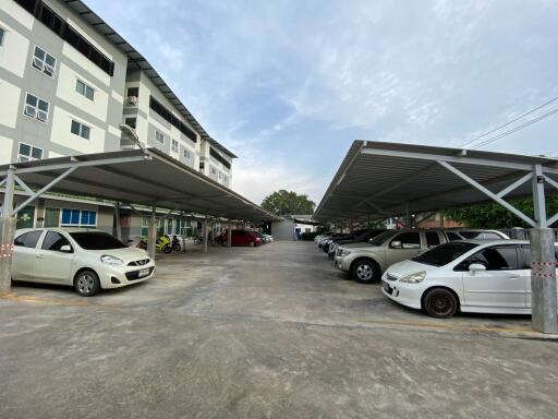 Covered parking area in front of apartments