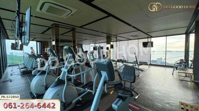 Fitness center with exercise equipment and large windows