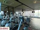 Fitness center with exercise equipment and large windows