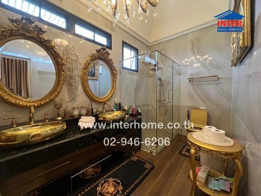 Luxurious bathroom with double sinks and glass shower