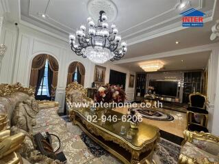 Luxury living room with ornate decor and chandelier