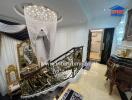 Luxurious foyer with chandelier and ornate decor