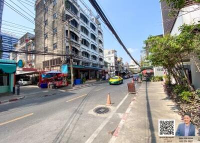 Street view with buildings and a taxi