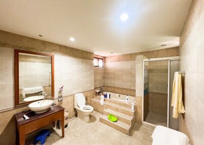 Spacious bathroom with bathtub and modern fixtures