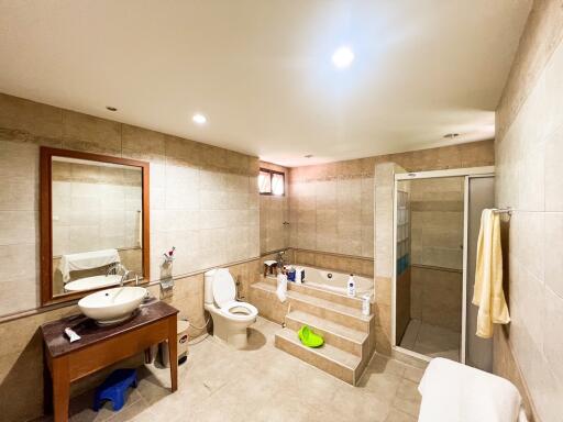 Spacious bathroom with bathtub and modern fixtures